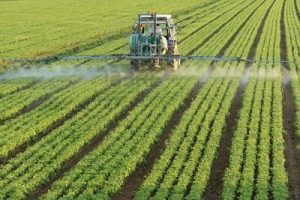 6431985-farming-tractor-spraying-a-field